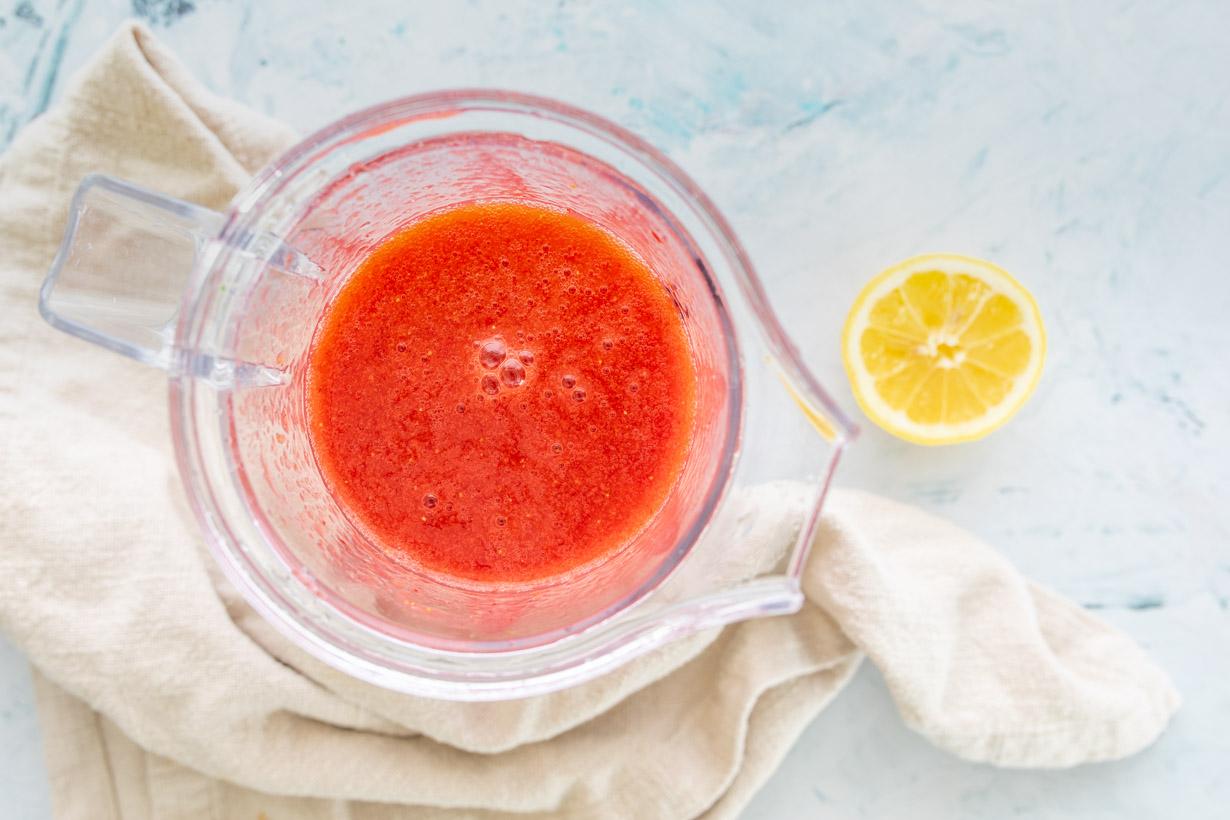 blended strawberry sauce in a blender jar