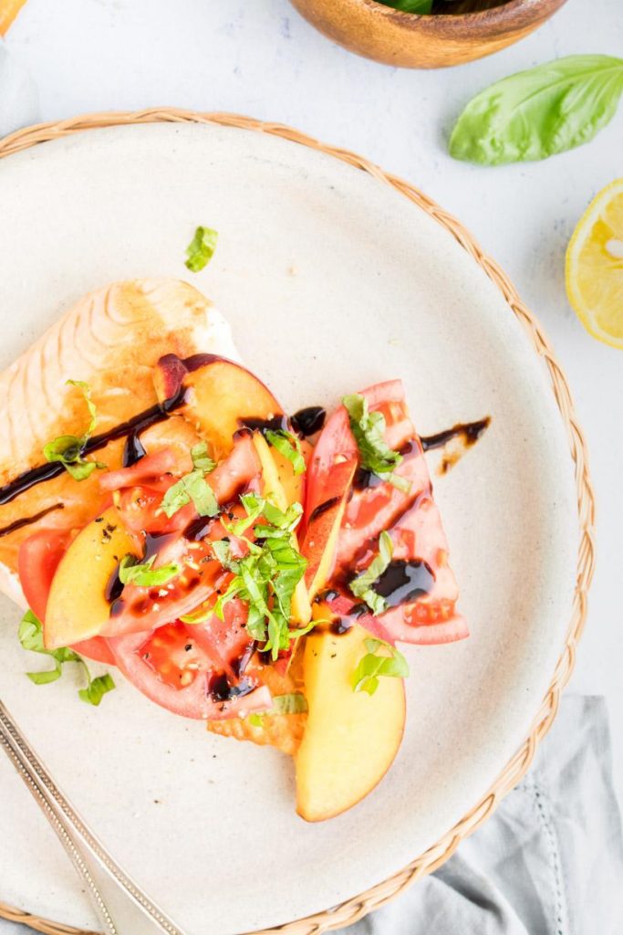 pan seared salmon with summer salad on a plate