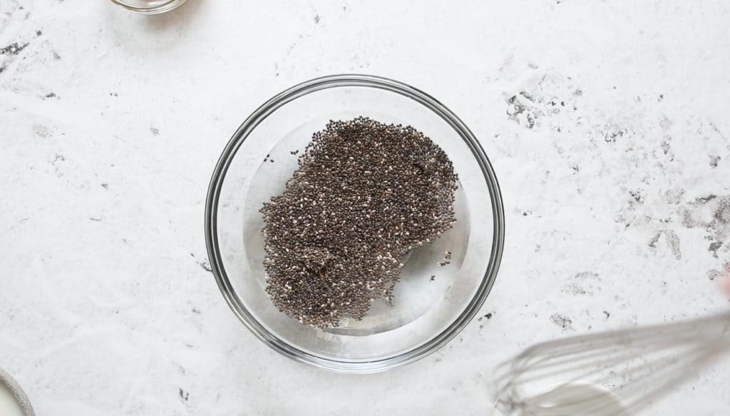 chia seeds and water in a glass bowl