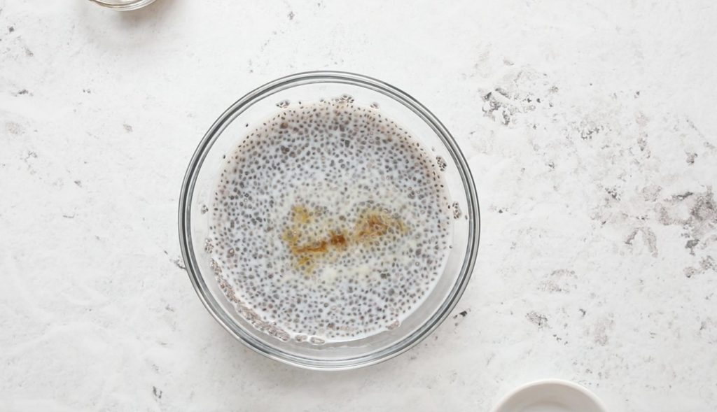 chia pudding with milk and vanilla in a glass bowl