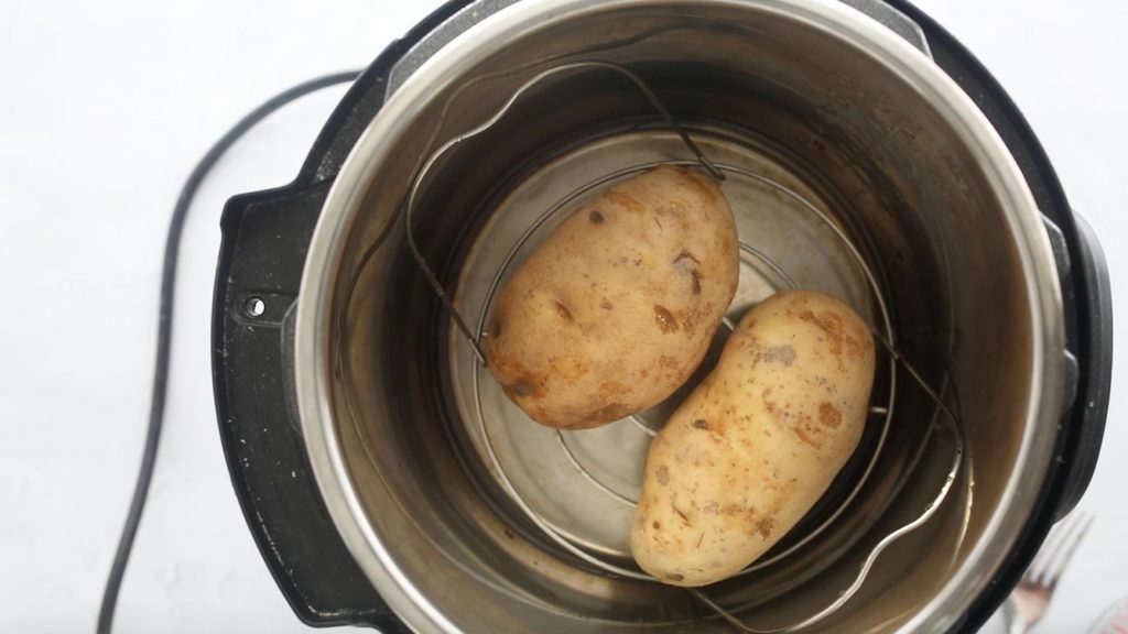 two russet potatoes in an instant pot bowl