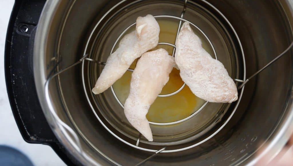 frozen chicken tenders on trivet in instant pot