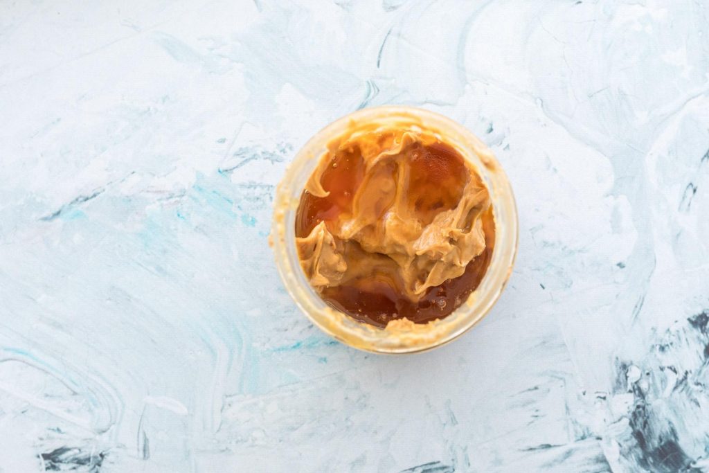 peanut butter and honey in a glass jar