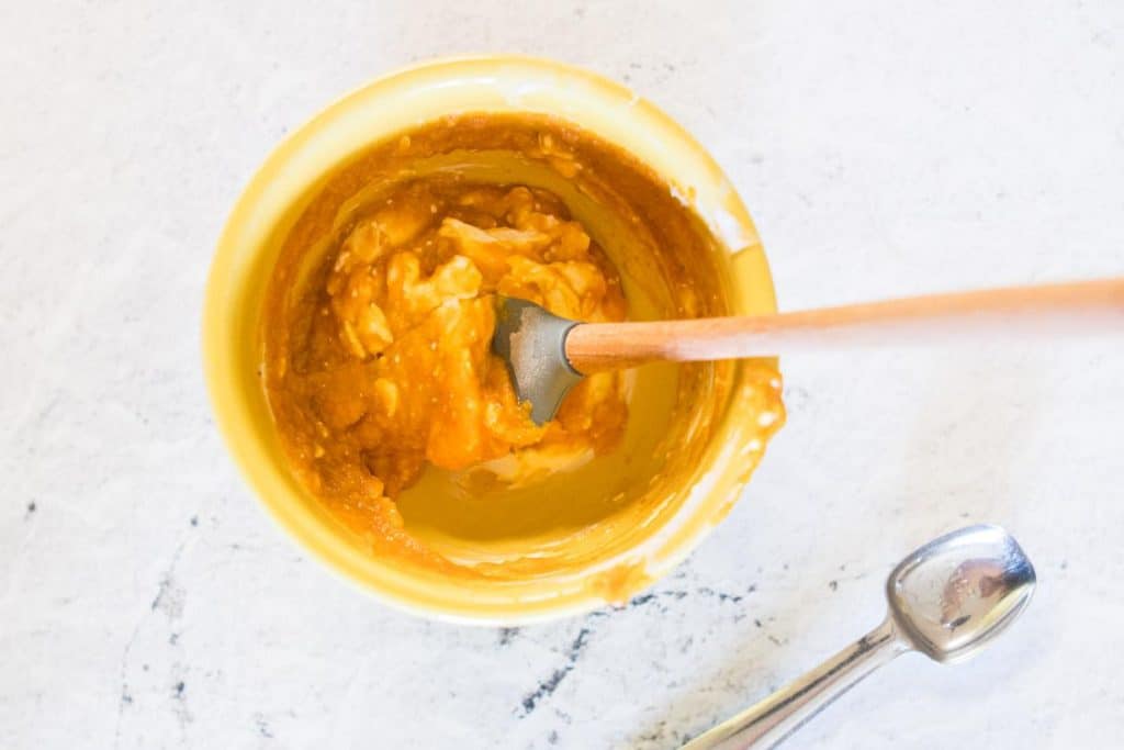pumpkin and cream cheese in a yellow bowl